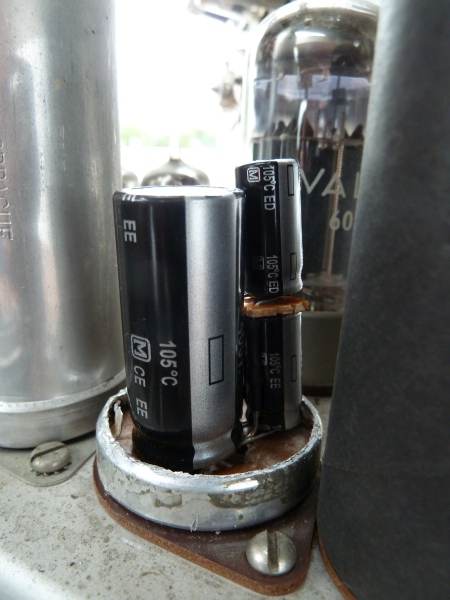 three new caps
sitting on the socket of the original cap